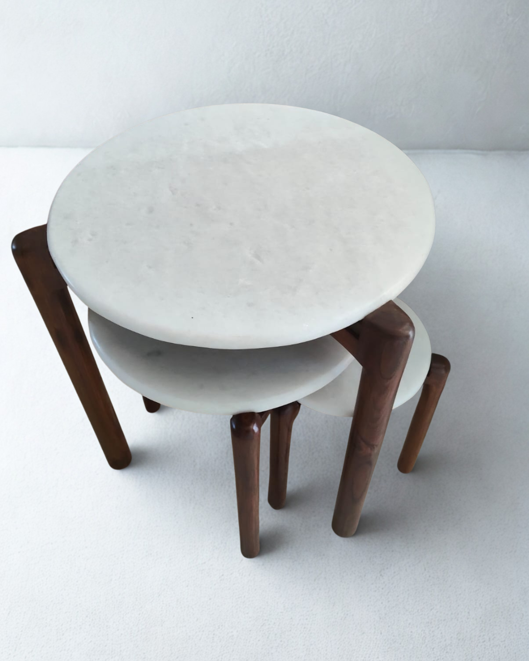 Set of three round stools with marble top and wooden legs made in teakwood