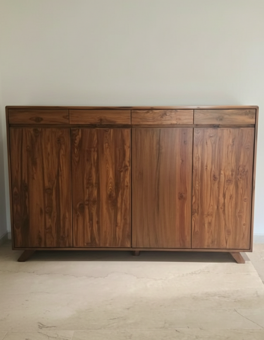 Wooden teakwood shoe cabinetwith multiple drawers and doors against a plain wall.